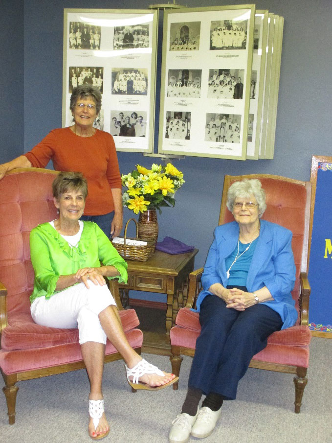 Lois (Danielson) Carlson (standing) with Luella (Danielson) Holwerda (left) and Eleanor (Danielson) Anderson (right) At Messiah Church, Lindsborg, Kansas, on July 18, 2017